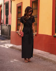 Robe femme noire longue col rond avec nœud à nouer et fente latérale Cléo